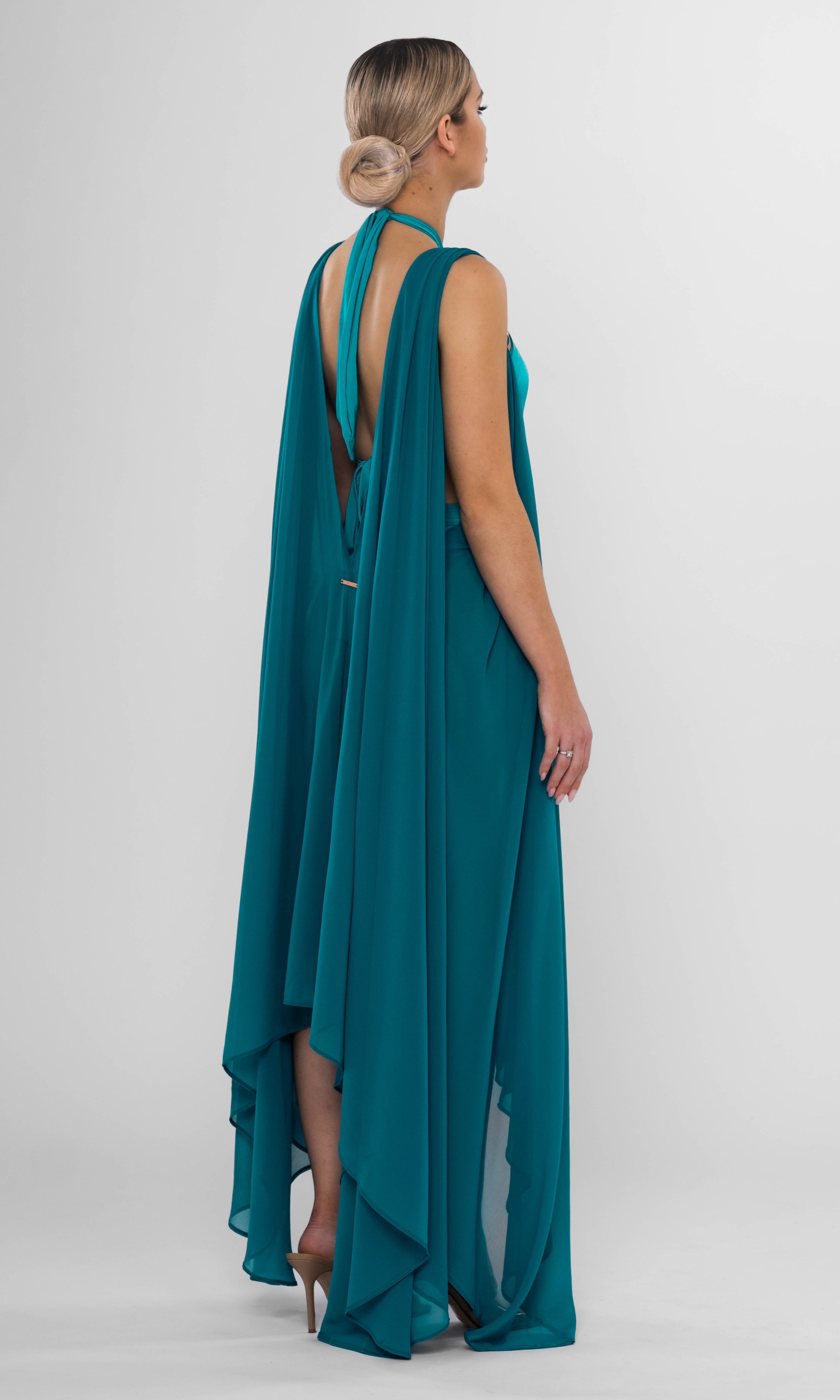 Luxury Clementine beach coverup in petrol by Antoninias, crafted with lightweight fabric and gold-tone accents for an elevated summer style.