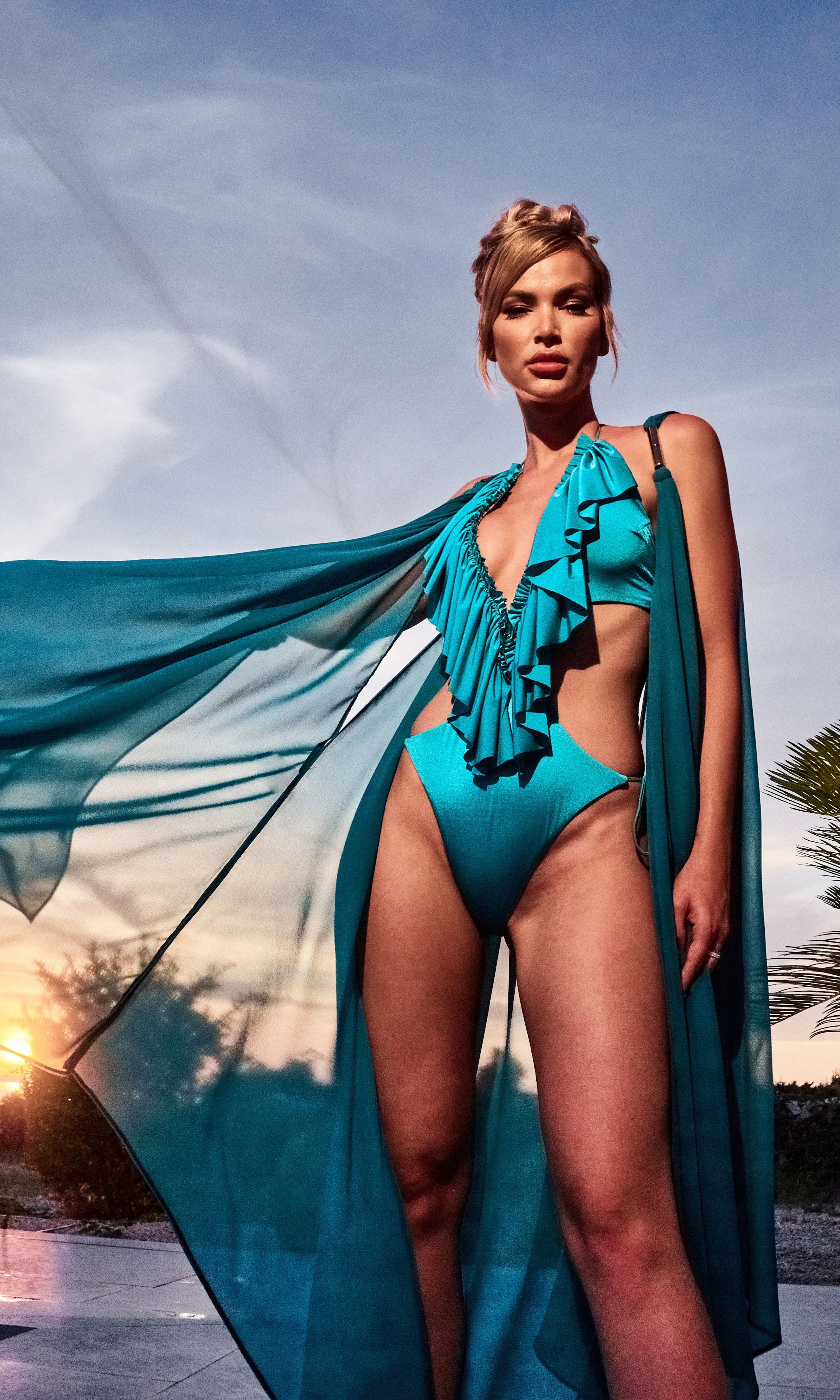 Luxury Clementine beach coverup in petrol by Antoninias, crafted with lightweight fabric and gold-tone accents for an elevated summer style.