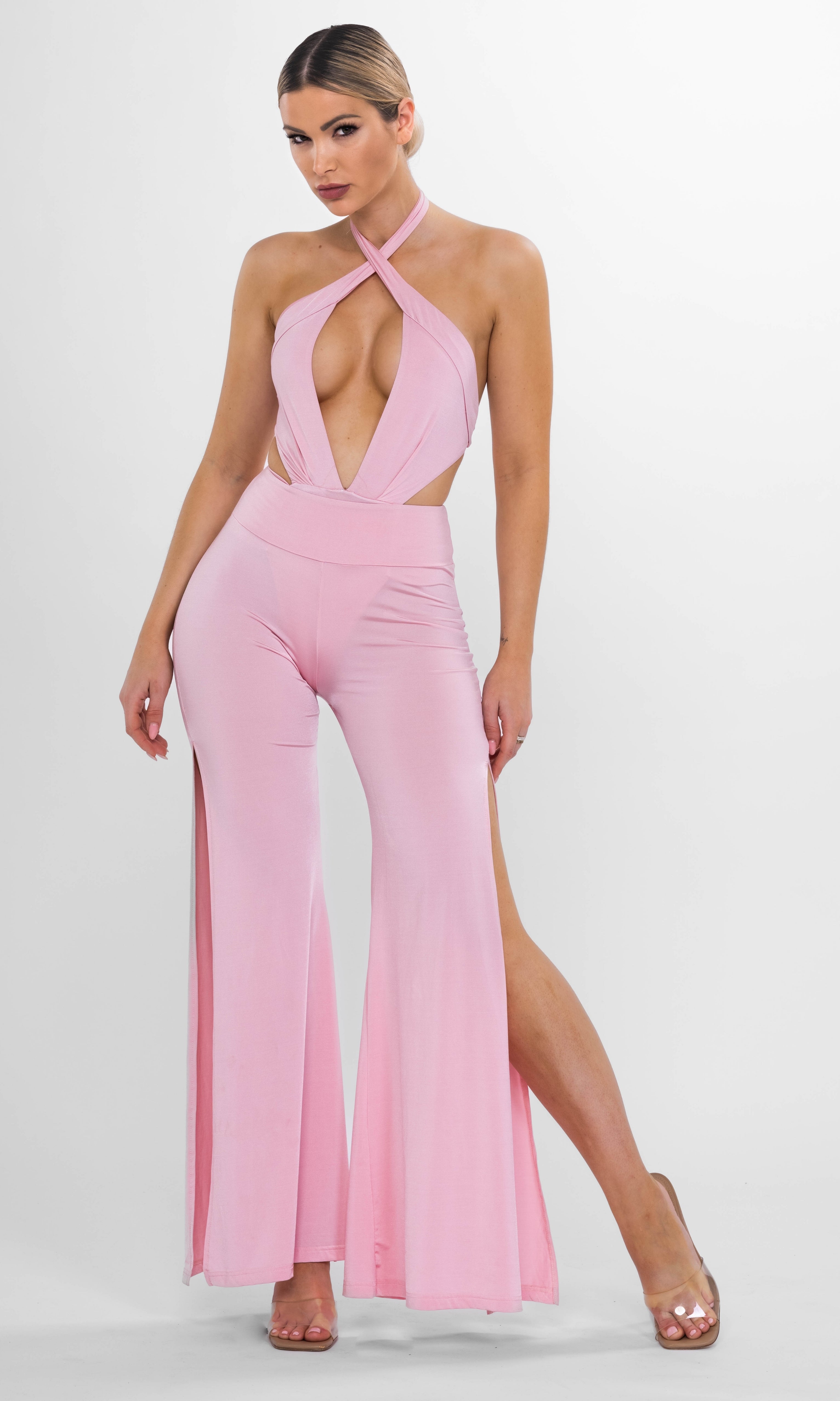 Luxury sustainable Cleo wide-leg pants in pink by Antoninias, featuring a flattering high-waisted design with elegant front slits, perfect for designer resort wear.
