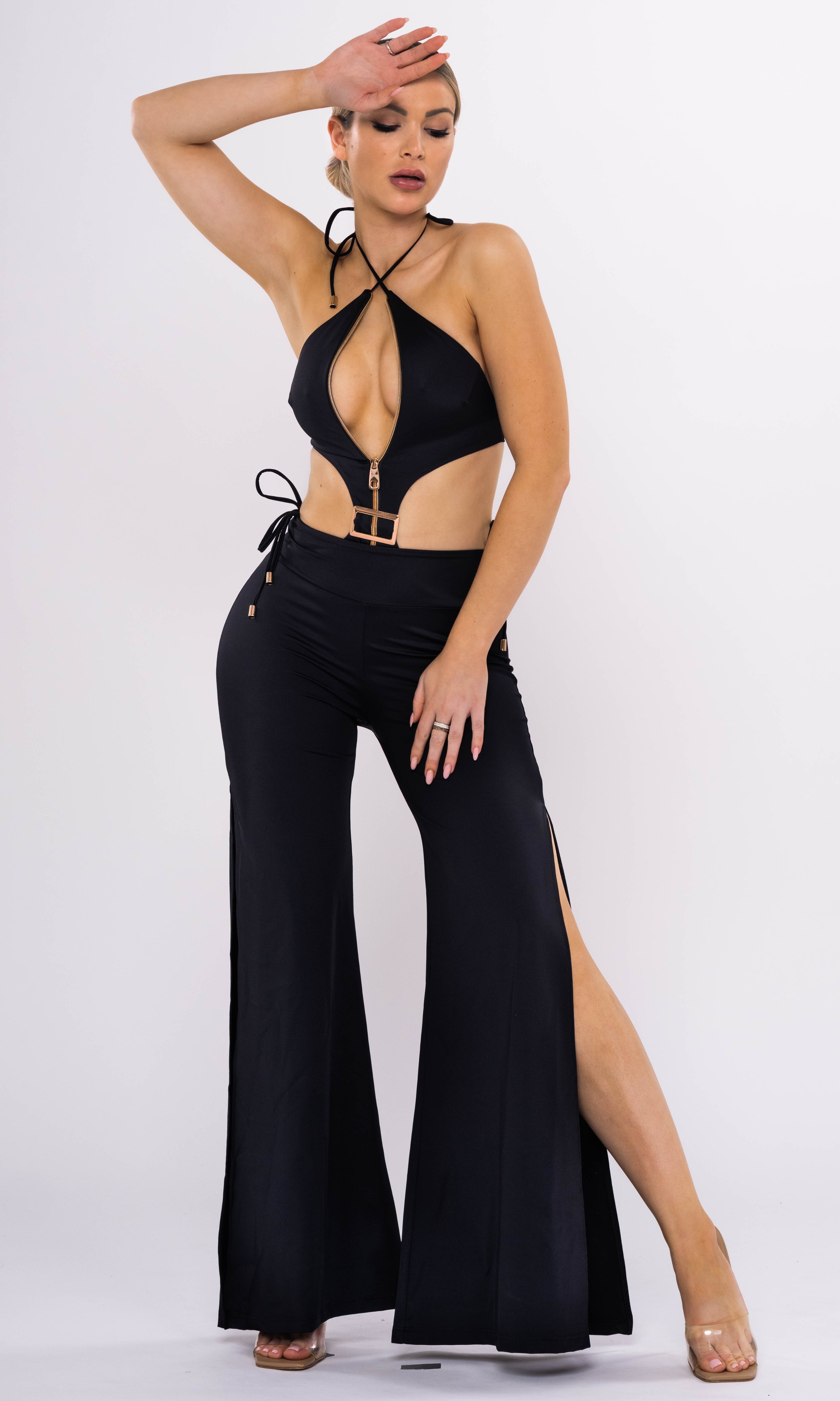 Antoninias Cynus sustainable one-piece swimwear with dramatic cut-outs, gold-tone buckle, and zip-front closure, ideal for luxury womenswear and elevated beach fashion.