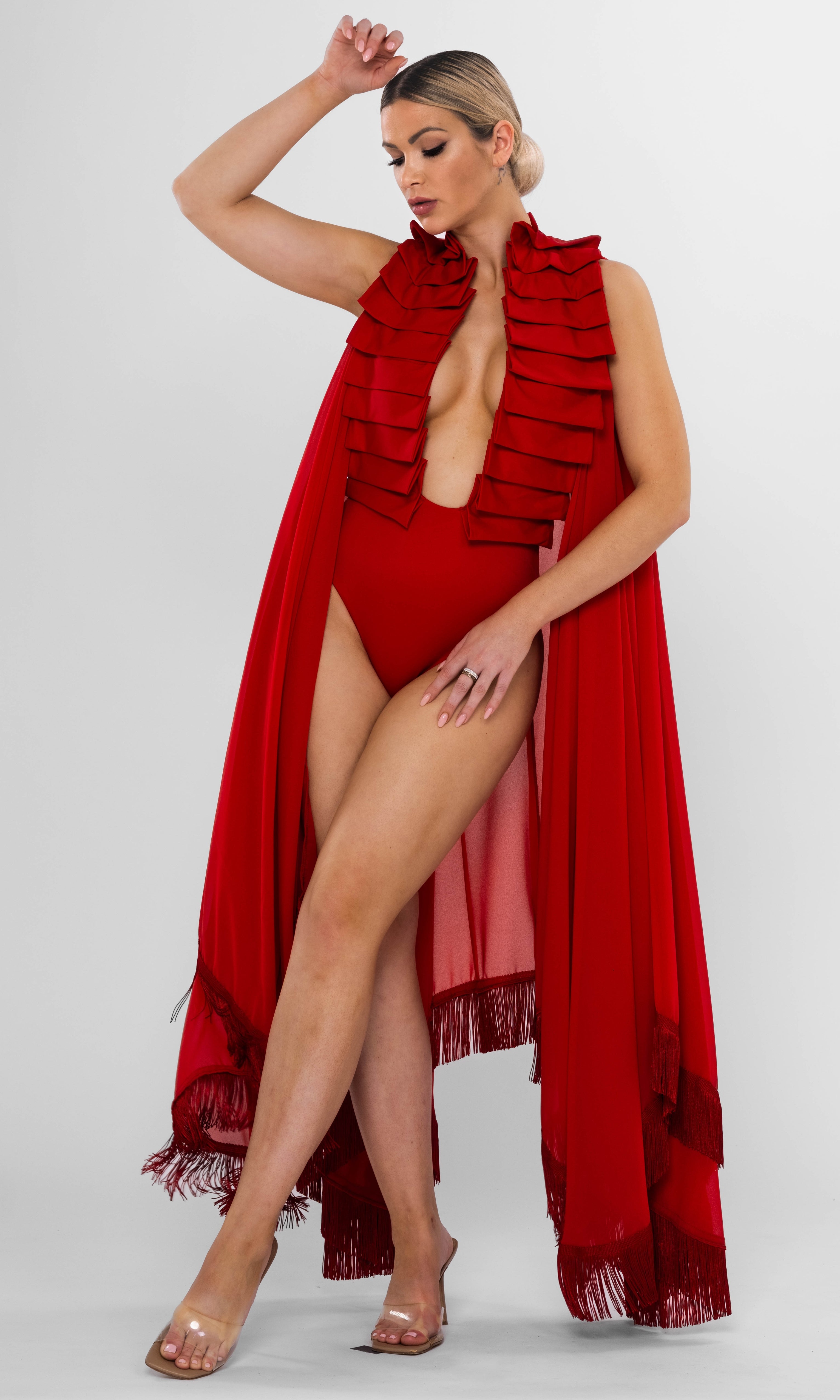 Antoninias Dahlia sustainable one-piece swimsuit with statement ruffles and gold chain accents, perfect for luxury resortwear and sophisticated womenswear.