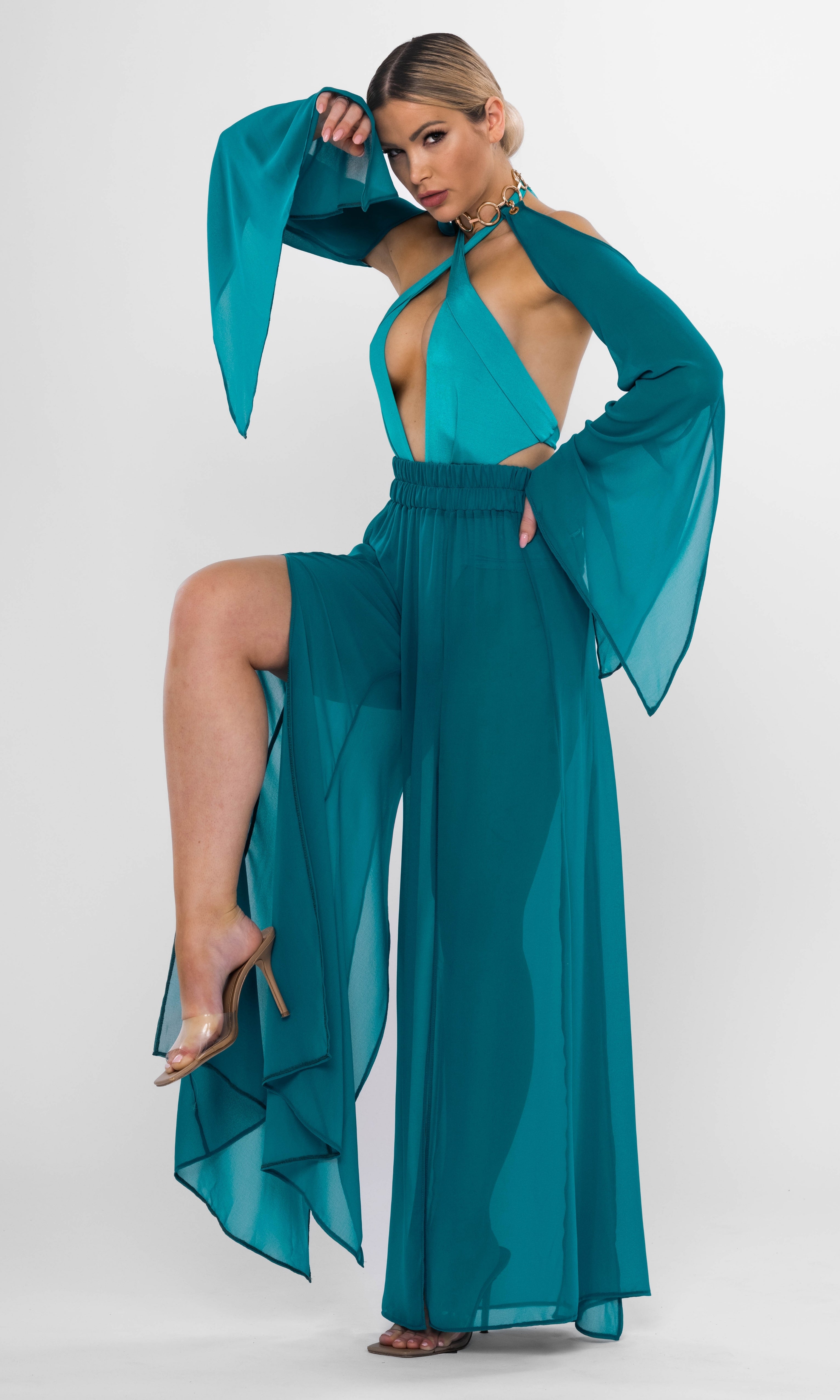 Luxury sustainable Elysia pants in petrol color by Antoninias, featuring a flowy wide-leg silhouette with dramatic slits, crafted for premium resort wear and sophisticated womenswear.