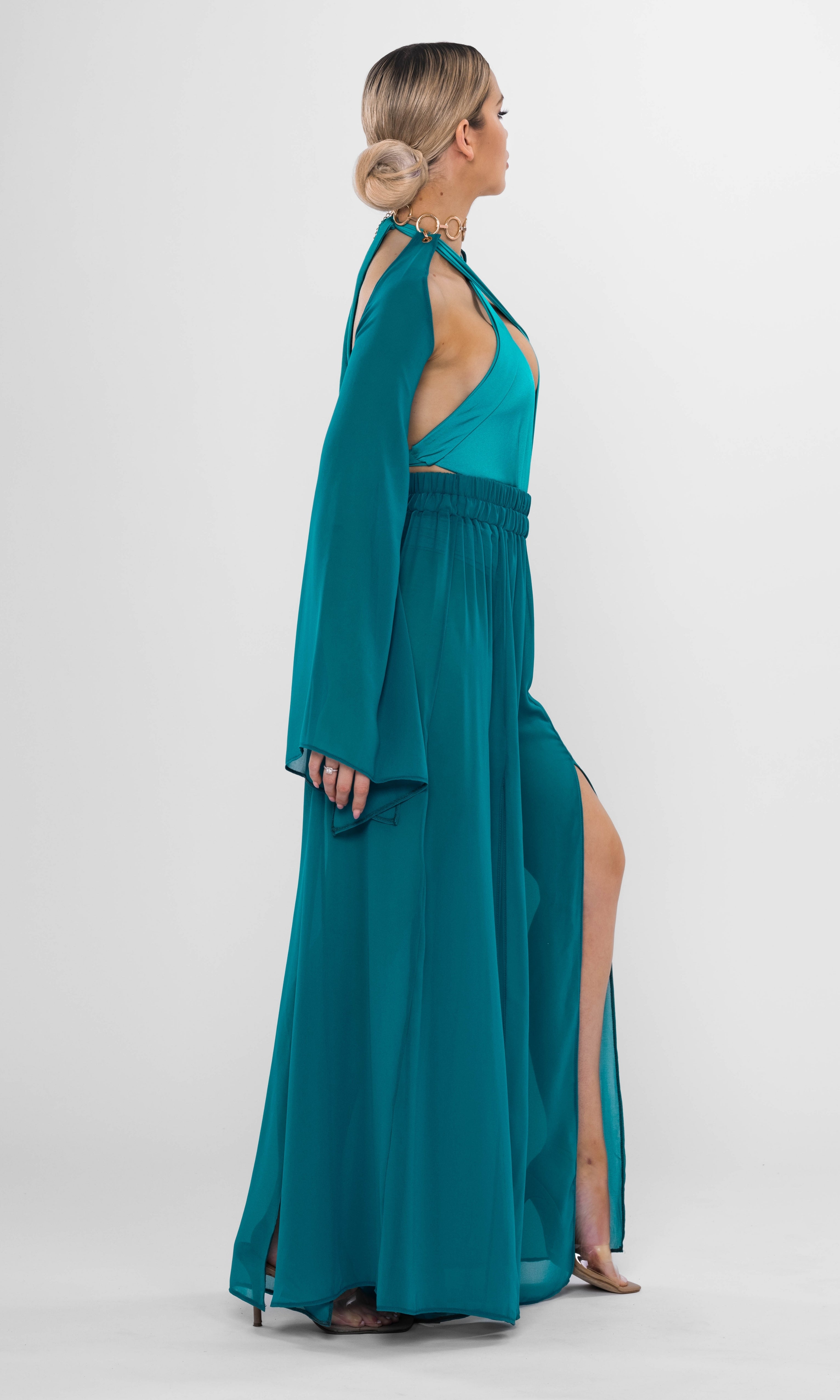 Luxury sustainable Elysia sleeves in petrol color by Antoninias, featuring dramatic flowing design with wide cuffs, crafted for premium resort wear and elegant womenswear.