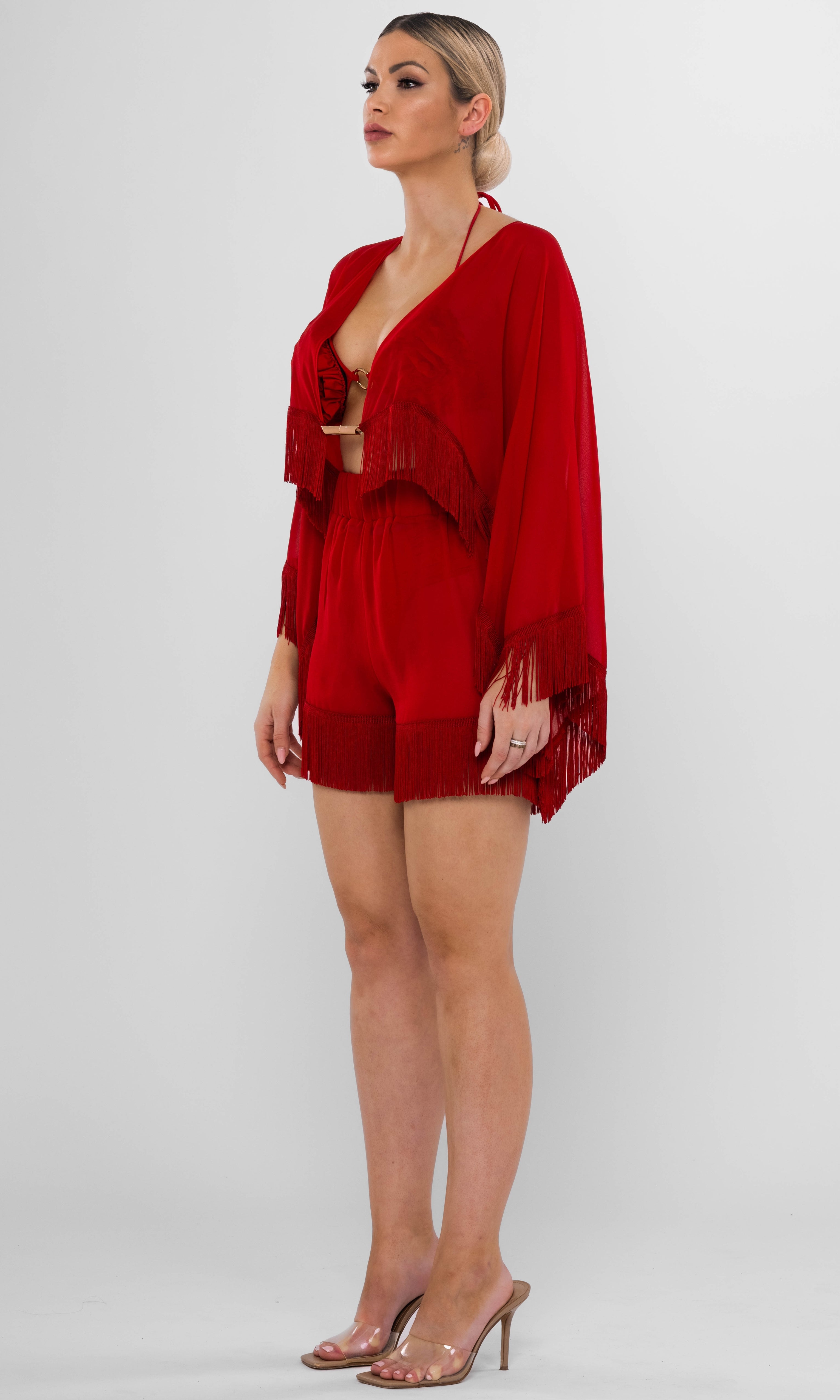 Antoninias Resita sustainable red beach cover-up set with kimono and fringed shorts, designed for luxury resortwear and elegant seaside fashion.