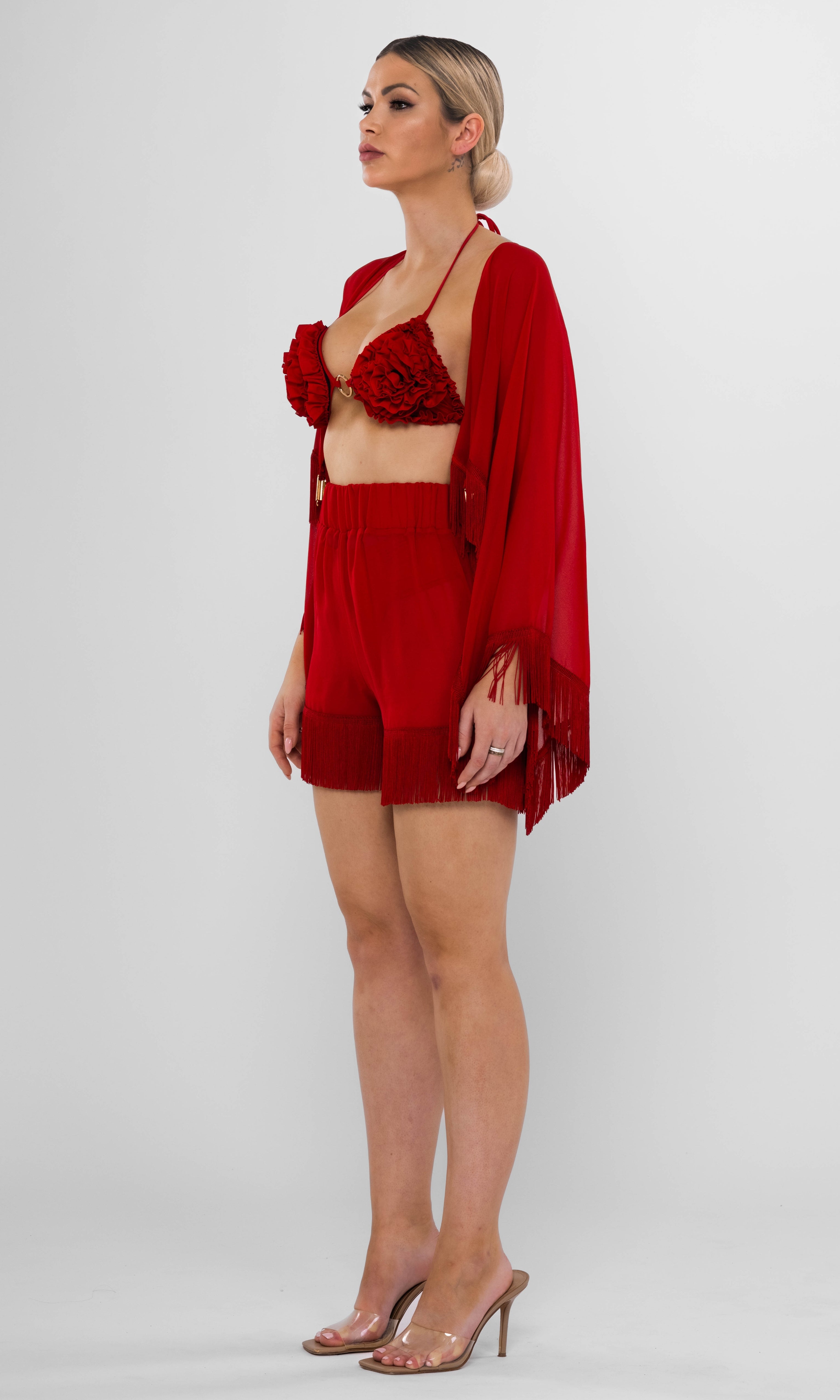 Antoninias Resita sustainable red beach cover-up set with kimono and fringed shorts, designed for luxury resortwear and elegant seaside fashion.