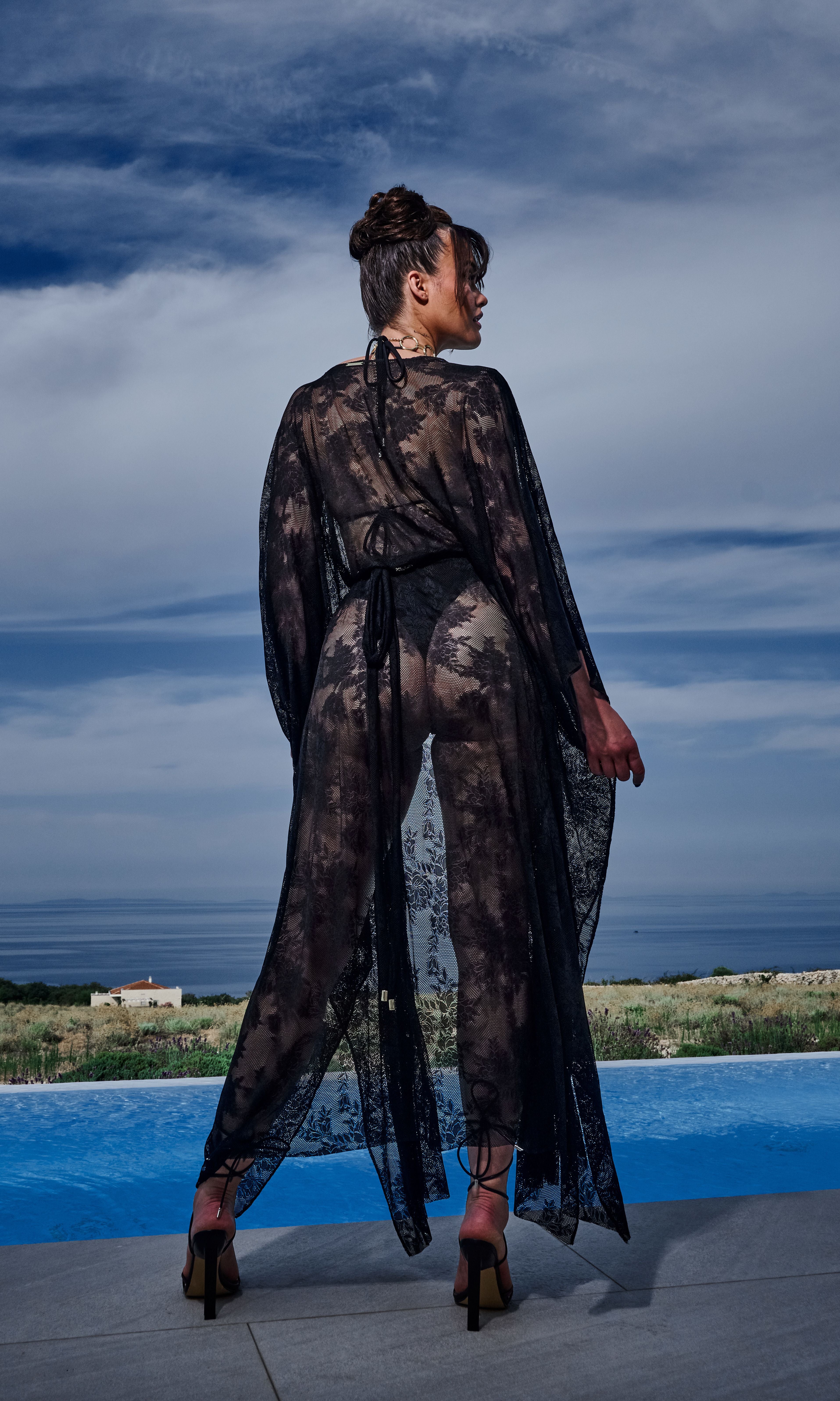 Antoninias Rose sustainable bikini top with luxurious ruffles and gold rings, crafted for upscale womenswear and designer resort swimwear.