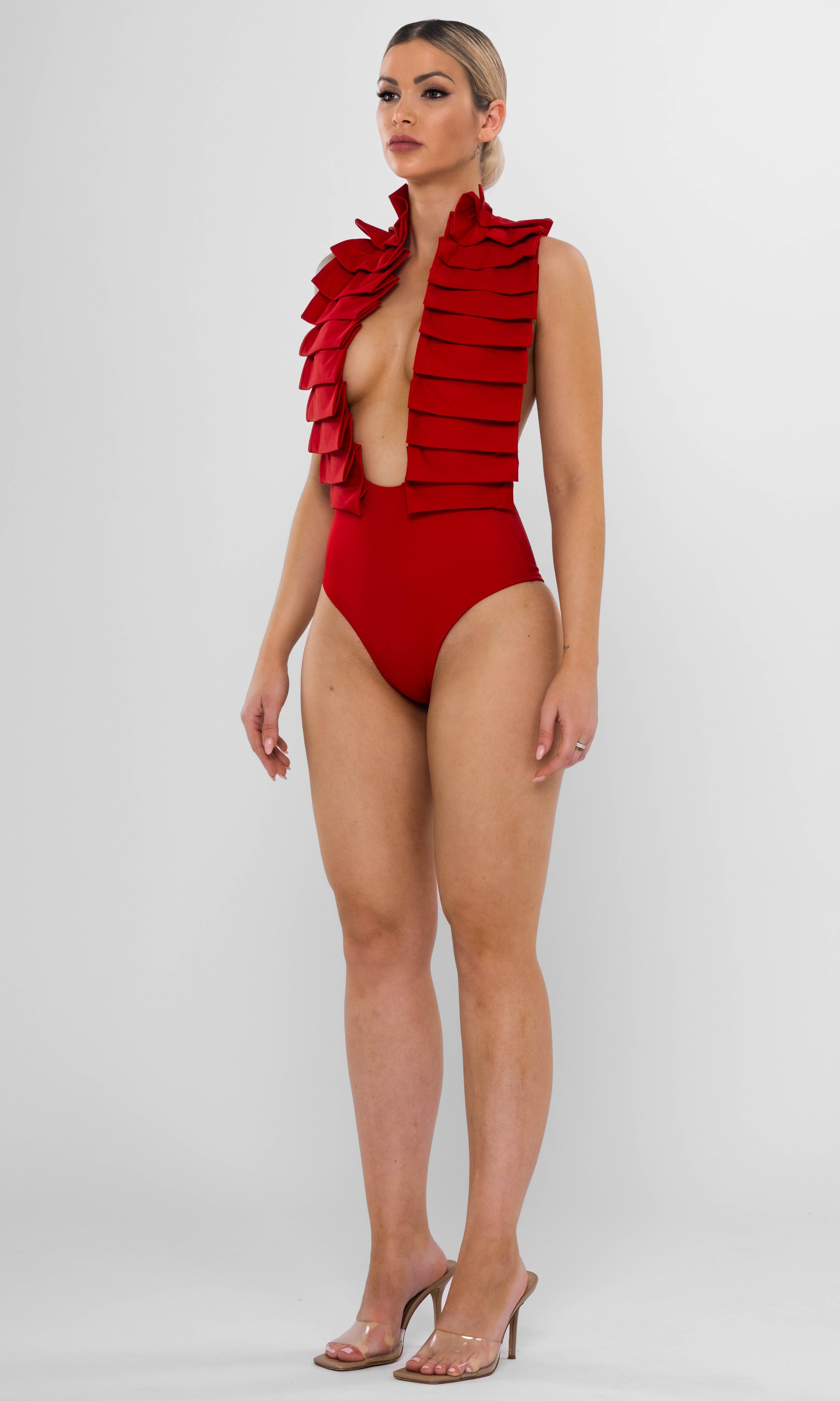Antoninias Dahlia sustainable one-piece swimsuit with statement ruffles and gold chain accents, perfect for luxury resortwear and sophisticated womenswear.