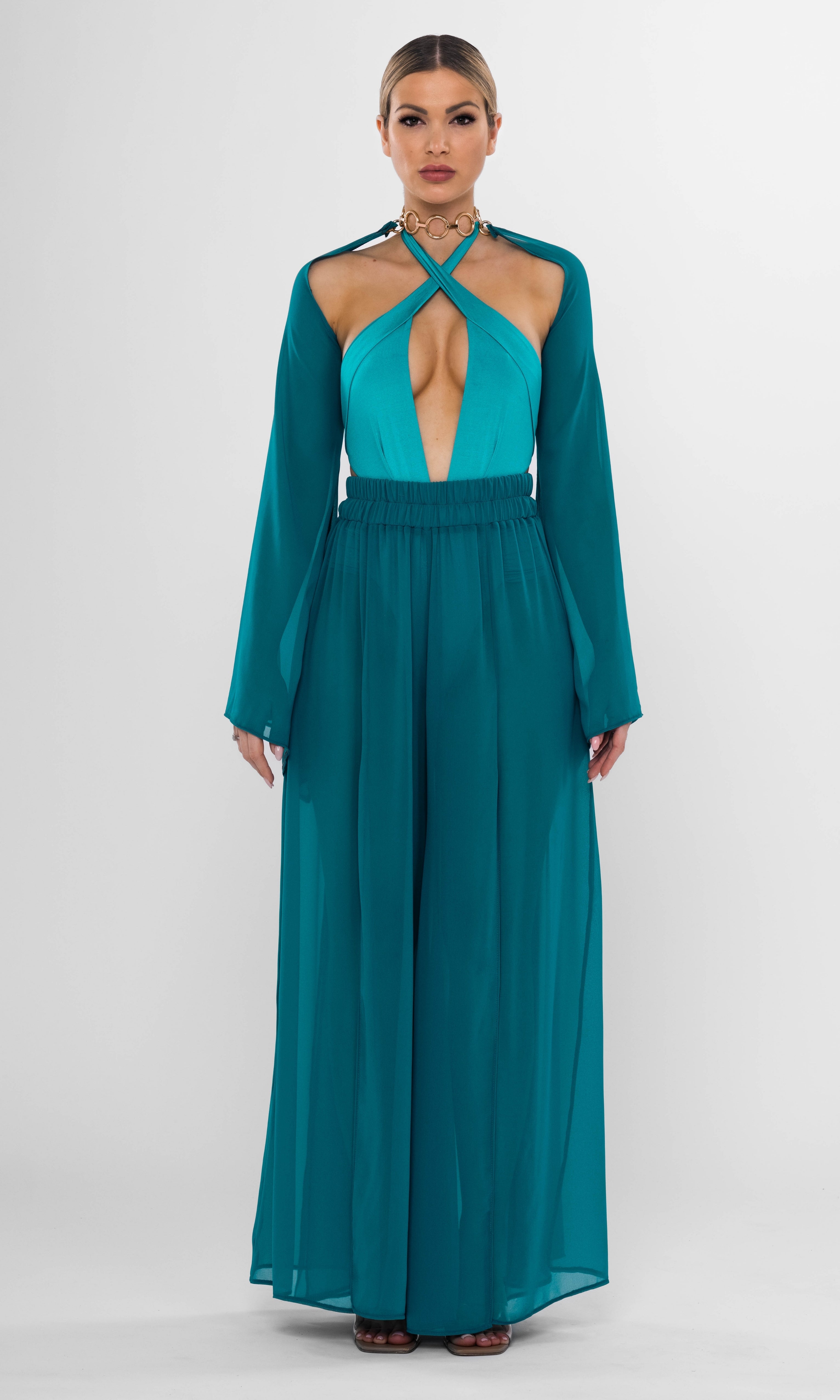 Luxury sustainable Elysia pants in petrol color by Antoninias, featuring a flowy wide-leg silhouette with dramatic slits, crafted for premium resort wear and sophisticated womenswear.