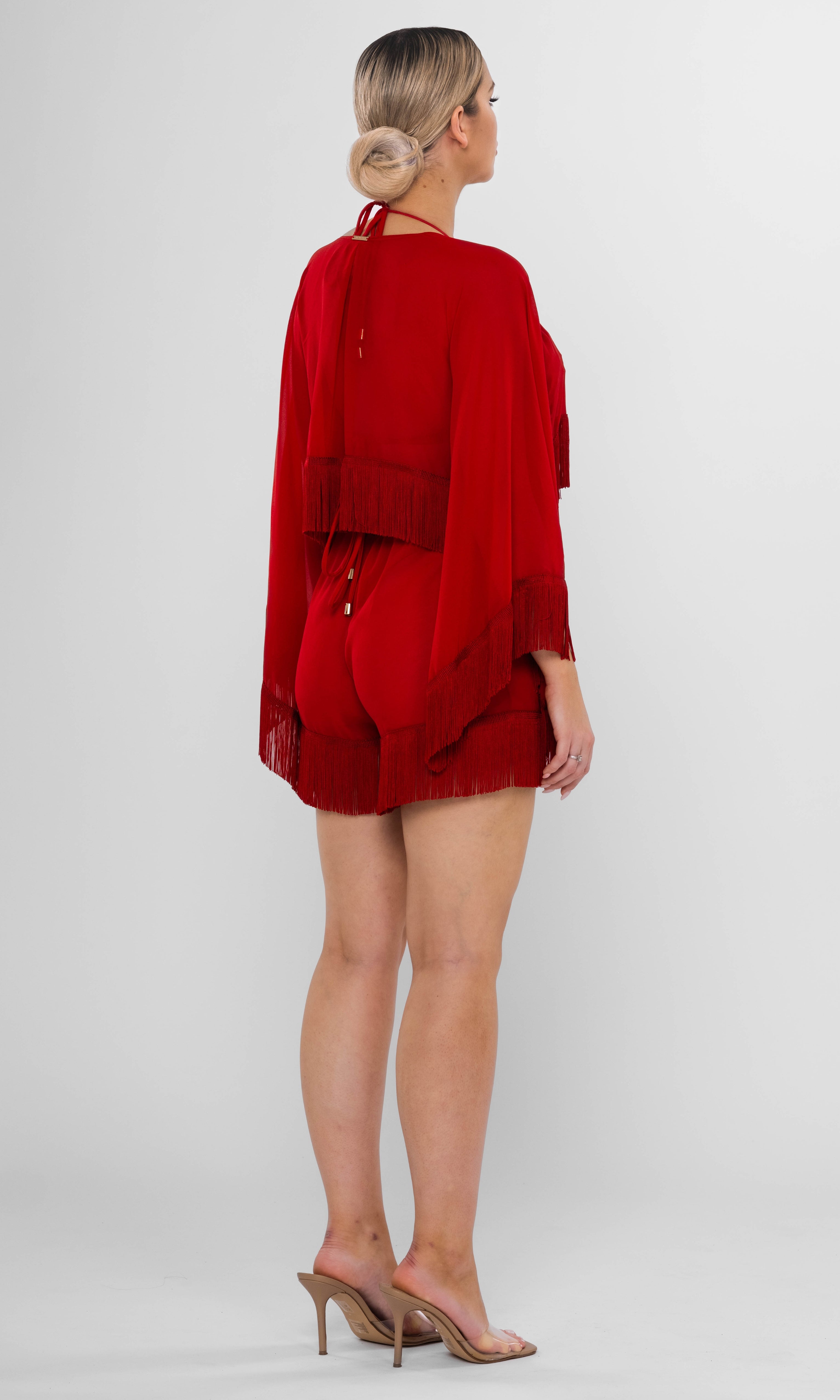 Antoninias Resita sustainable red beach cover-up set with kimono and fringed shorts, designed for luxury resortwear and elegant seaside fashion.