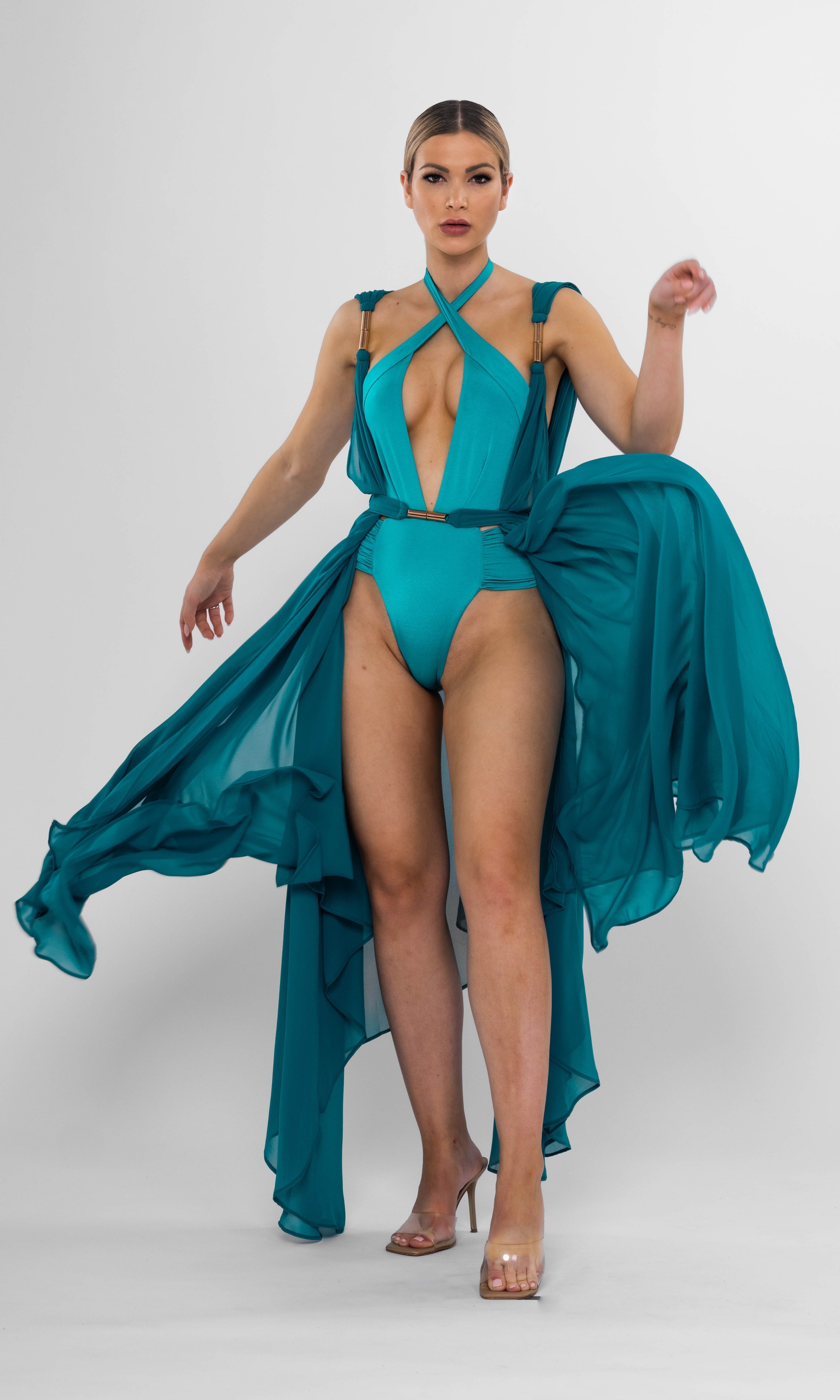 Melanie one-piece swimsuit in petrol by Antoninias, showcasing a sophisticated silhouette with ruched details and a cross-neckline — perfect for luxury beach days.